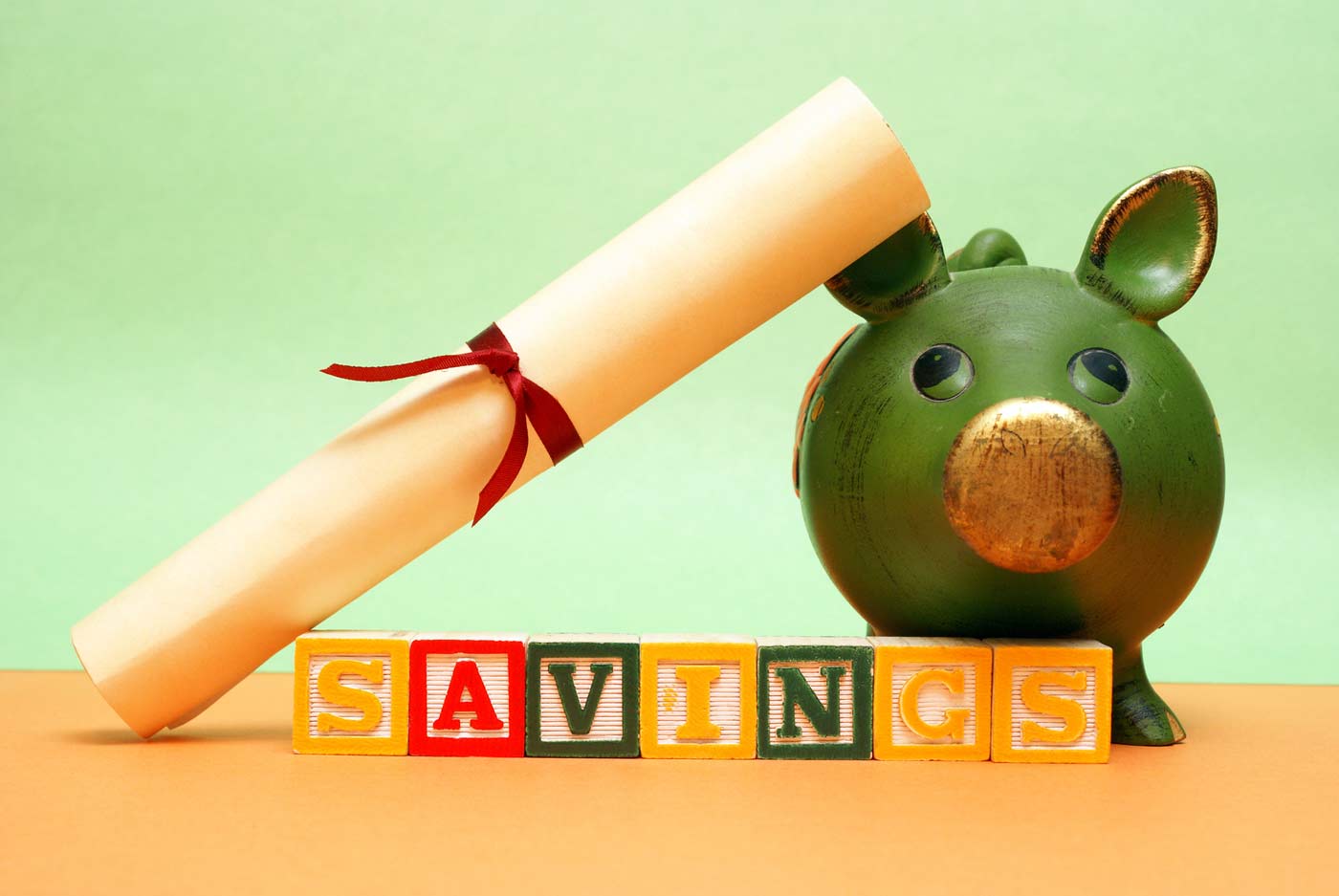 Piggy bank, savings and university scroll
